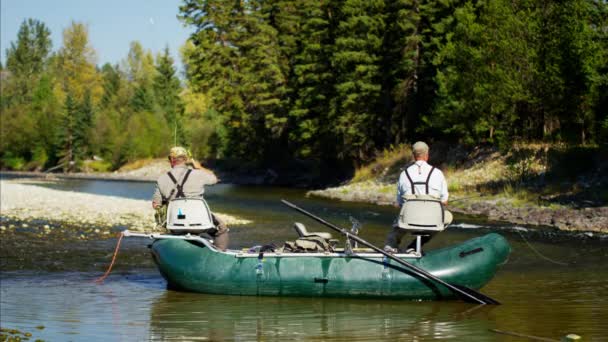 People fly fishing from dingy — Stock Video