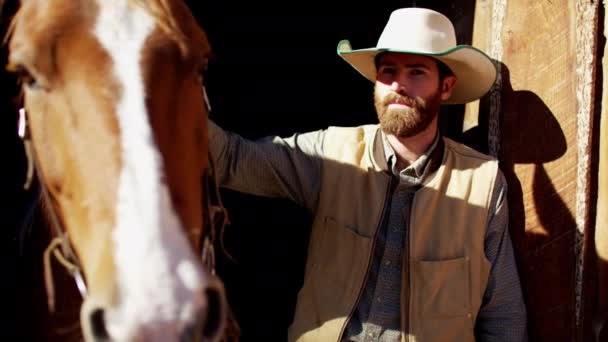 Cowboy with his horse on Dude Ranch — Stock Video