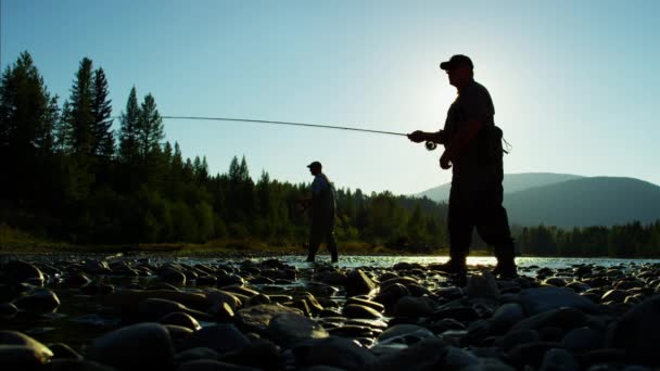 Fisherman casting line in freshwater river — Stock Video
