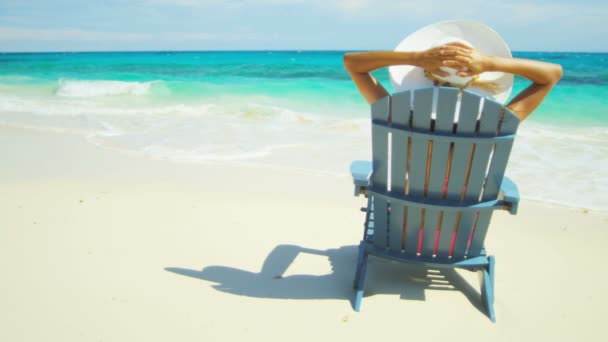 Girl sunbathing on beach — Stock Video