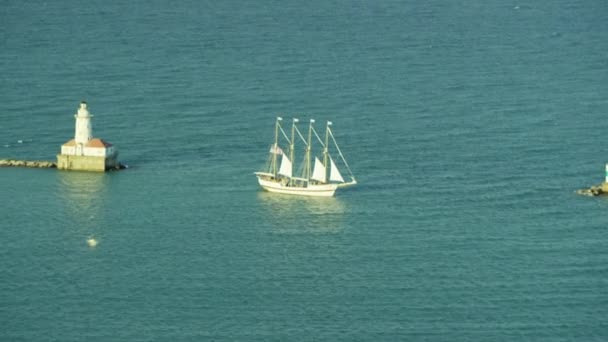 Lighthouse and sailing boat on Lake Michigan — Stock Video