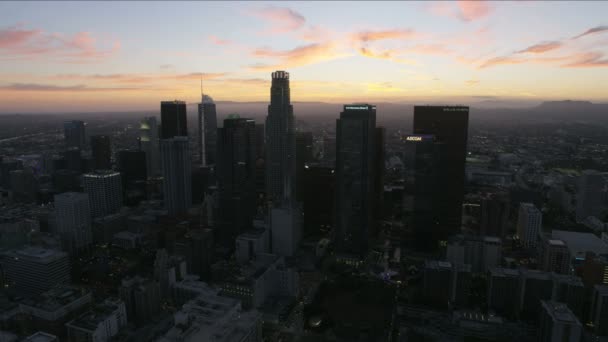 Aerial view downtown Los Angeles skyscrapers at sunset — Stockvideo