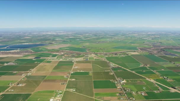 Aerial view crops growing patchwork fields California scenery — Stock Video
