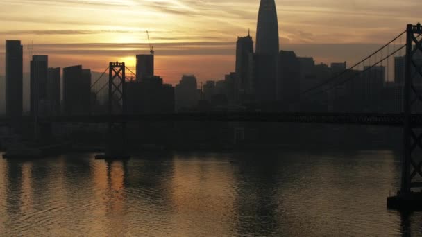 Aerial sunset view Oakland Bay bridge San Francisco — стокове відео