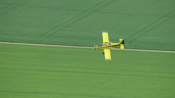 Aerial view light aircraft agricultural crop dusting USA — Stockvideo