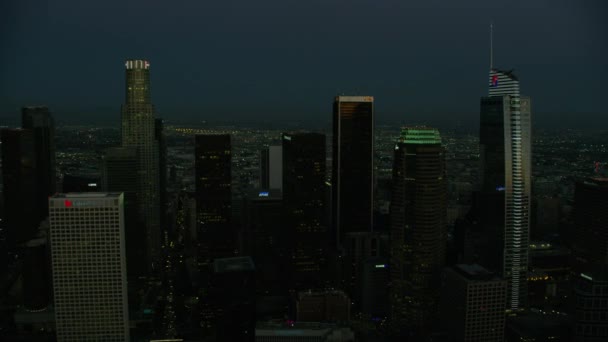 Aerial illuminated sunset view Los Angeles skyscraper buildings — Stockvideo