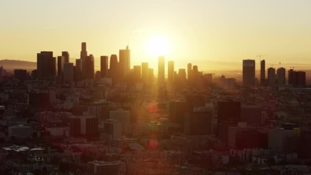 Aerial sunrise view with sun flare LA skyline — Stock Video