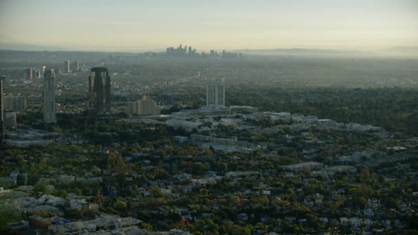 Aerial view at sunrise LA suburbs and skyline — Stock Video