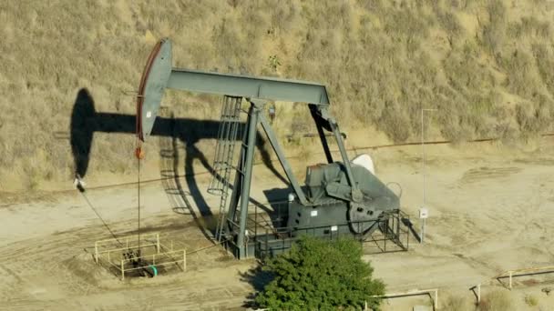 Aerial view nodding donkey pumping oil Los Angeles — Stock Video
