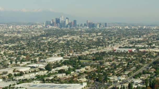 Aerial cityscape view Los Angeles skyline and mountains — Stock Video