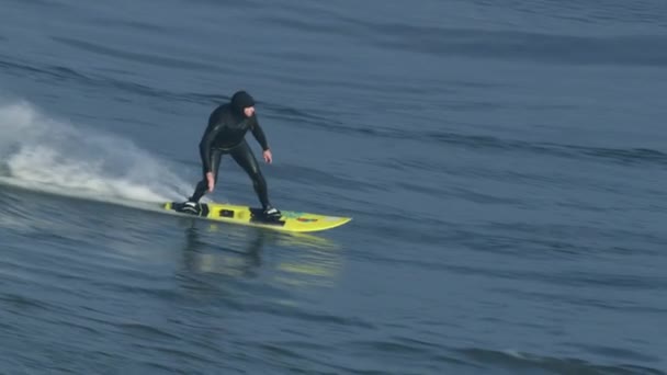 Aerial male surfer on big wave Mavericks USA — Stock Video