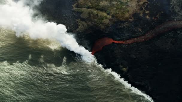 Aerial view of molten volcanic lava entering ocean — Stock Video