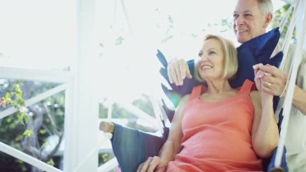 Retired Caucasian couple chilling in hammock chair Bahamas — Stock Video