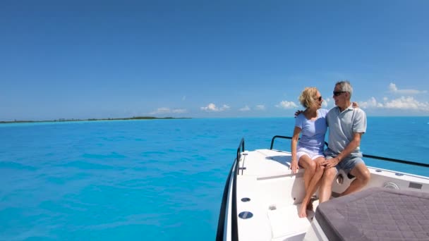 Carefree male and female seniors on sailboat Bahamas — Stock Video