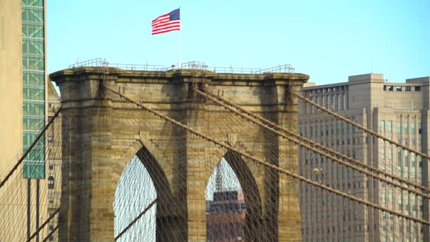 American flag flying Brooklyn Bridge lower Manhattan USA — Stock Video
