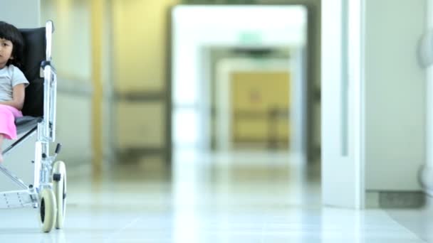 Ethnic Female Nurse Reassuring Young Child Patient — Stock Video