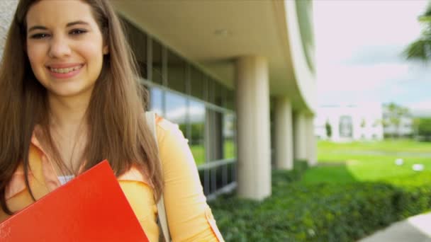 Female student holding workbook — Stock Video