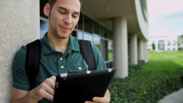 Male student with wireless tablet — Stock Video