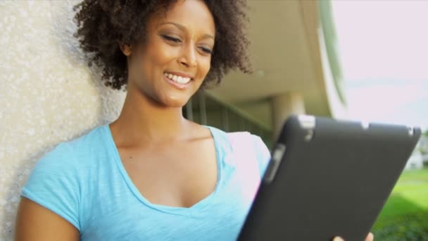 Female student holding wireless tablet — Stock Video