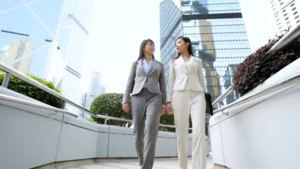 Businesswomen walking near office building — Stock Video