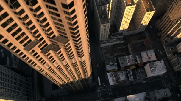 Aerial vertical view of rooftop city buildings traffic — Stock Video