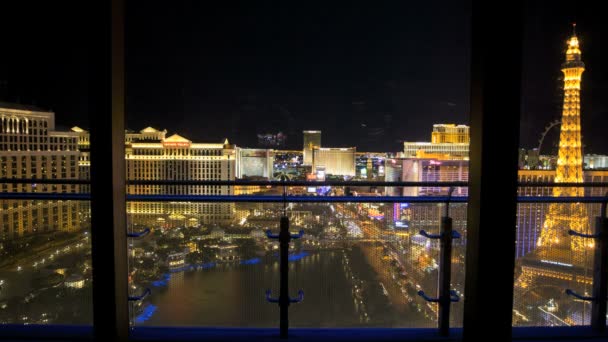 Window night Bellagio fountain Las Vegas Strip traffic — Stock Video