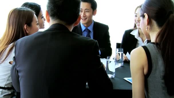 Asian banking executives in boardroom — Stock Video