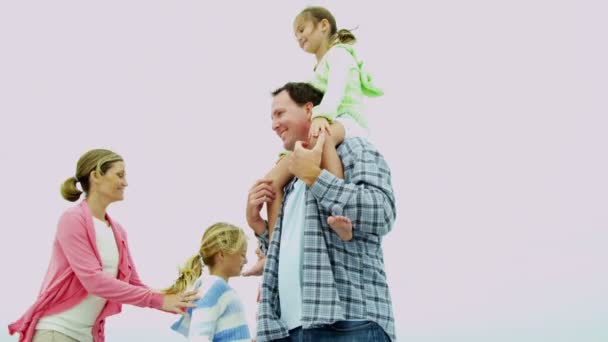 Parents and daughters on sandy beach — Stock Video