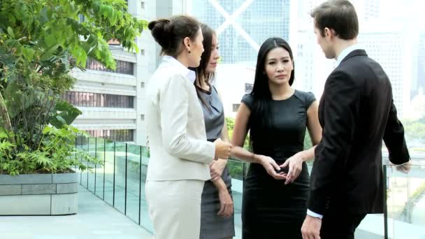 Business colleagues outside office building — Stock Video