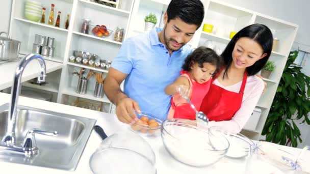 Girl with parents making cookie — Stock Video