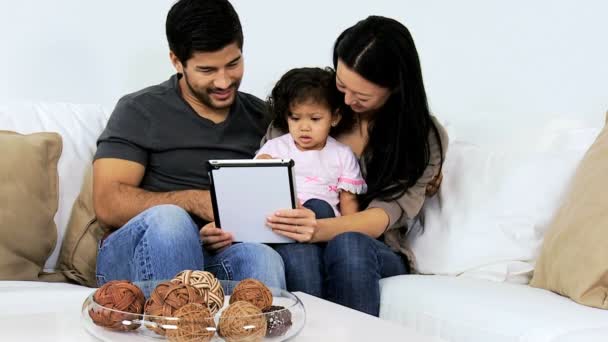 Parents with daughter using tablet — Stock Video