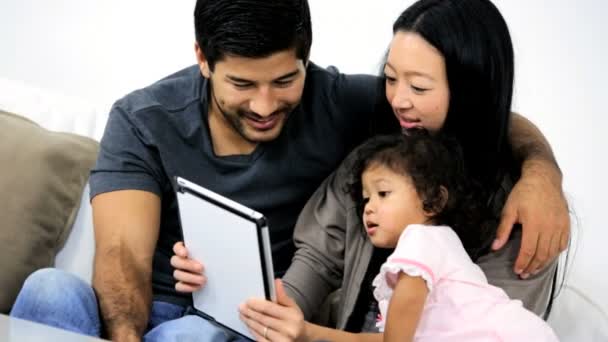 Parents with daughter using tablet — Stock Video