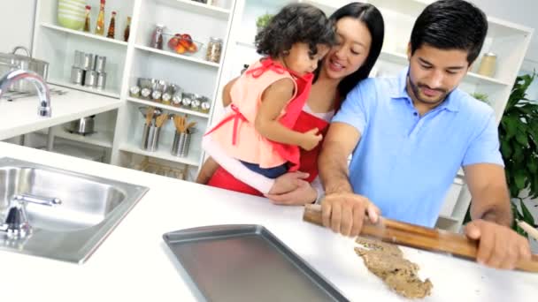 Girl with parents making cookie — Stock Video