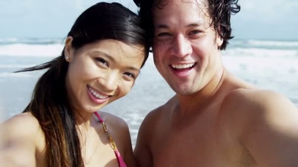 Couple having fun on beach — Stock Video