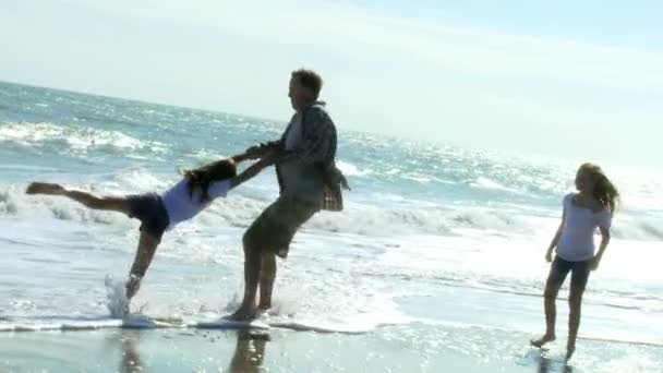 Father with daughters on beach — Stock Video