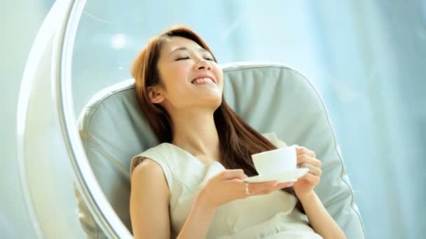 Woman in chair with coffee — Stock Video