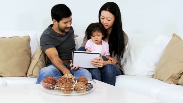 Parents with daughter using tablet — Stock Video