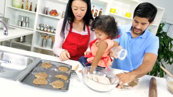 Girl with parents making cookie — Stock Video