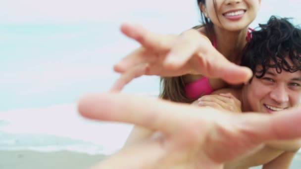 Couple having fun on beach — Stock Video