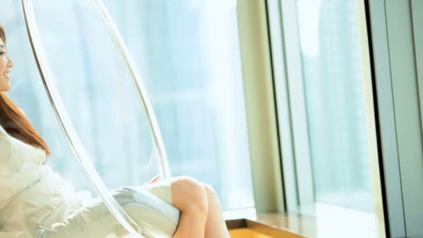 Woman relaxing in bubble chair — Stock Video