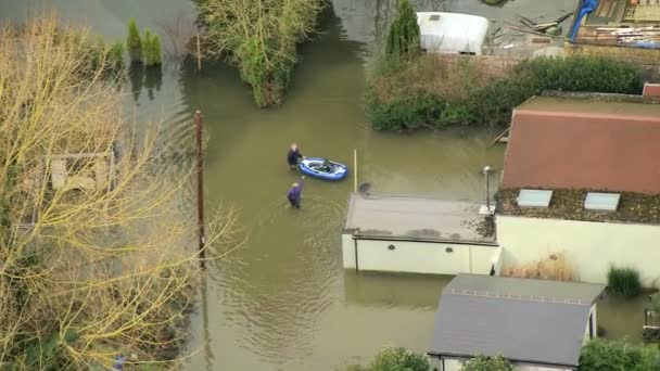 Local people wades through floodwaters — Stock Video