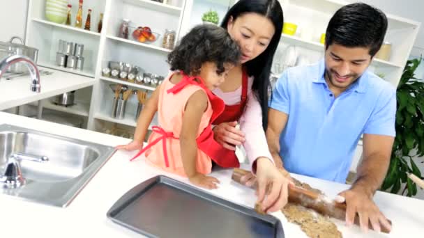 Girl with parents making cookie — Stock Video