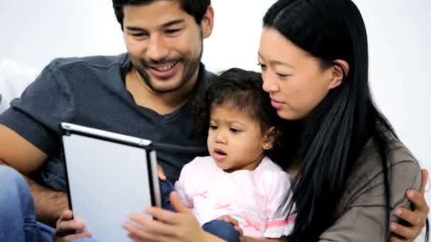 Parents with daughter using tablet — Stock Video