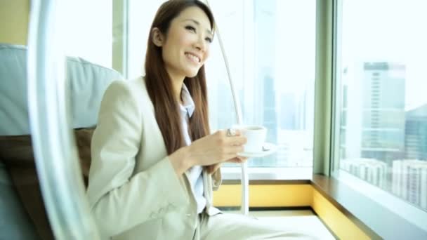 Woman drinking coffee in chair — Stock Video