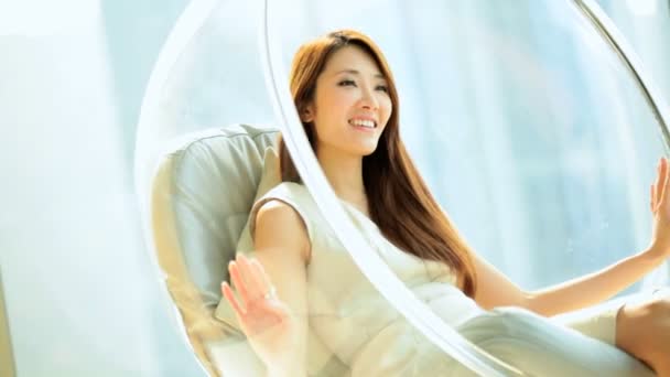 Woman relaxing in bubble chair — Stock Video