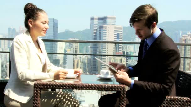 Business associates in rooftop restaurant — Stock Video