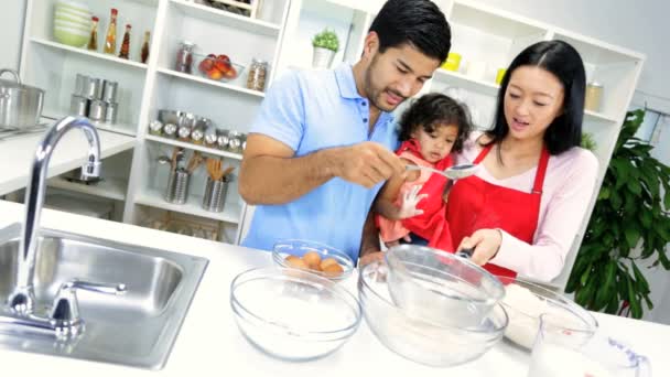 Girl with parents making cookie — Stock Video