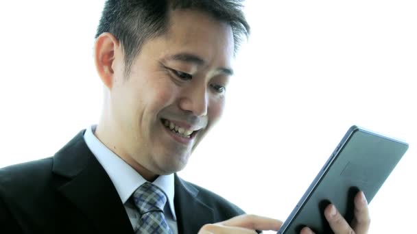 Asian stock broker using tablet — Stock Video
