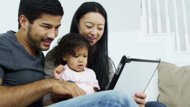 Couple with daughter playing on tablet — Stock Video