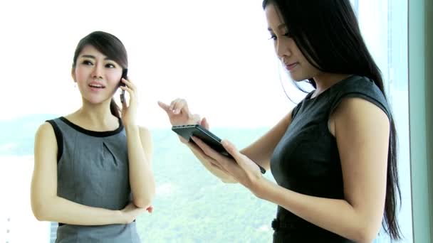 Businesswomen using smartphone and tablet — Stock Video